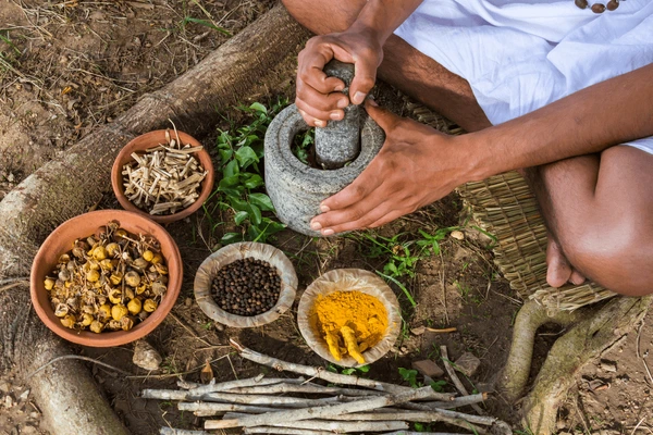 young-man-preparing-ayurvedic-medicine-600nw-320588870